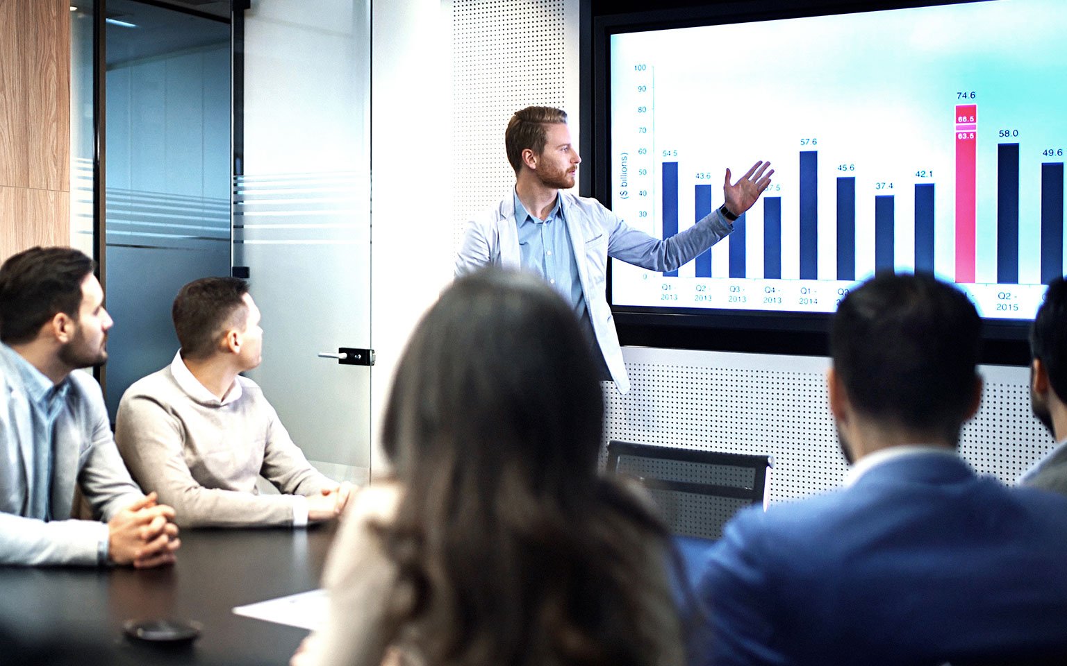 man presenting a graph in a meeting