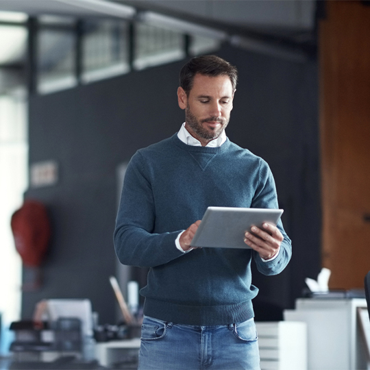 man working with his tablet