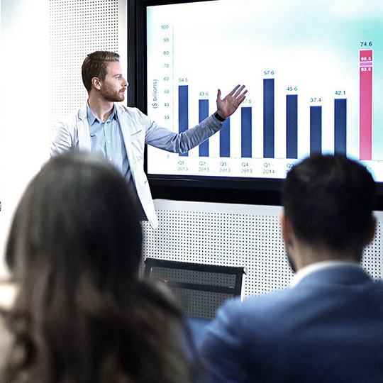man presenting numbers