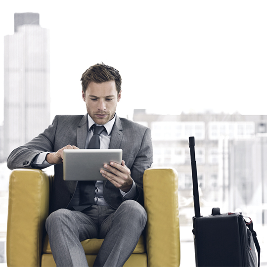 man waiting with his tablet