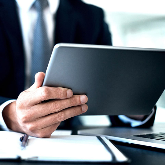 hands holding a tablet