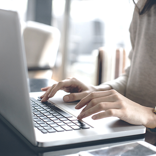 woman typing in a computer